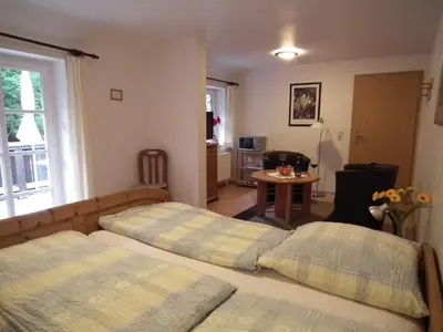 Ein Bett oder Betten in einem Zimmer der Unterkunft Ferienwohnung Nexö 25 qm, 1 Wohn-Schlafzimmer N7