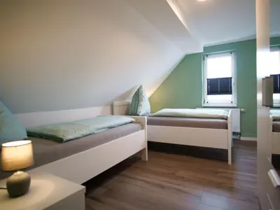 Ein Bett oder Betten in einem Zimmer der Unterkunft Ravensberg