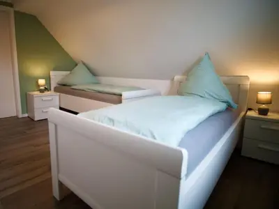 Ein Bett oder Betten in einem Zimmer der Unterkunft Ravensberg