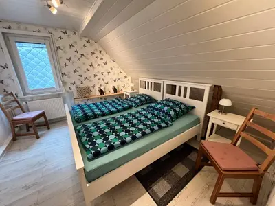 Ein Bett oder Betten in einem Zimmer der Unterkunft Bienenhof Illers