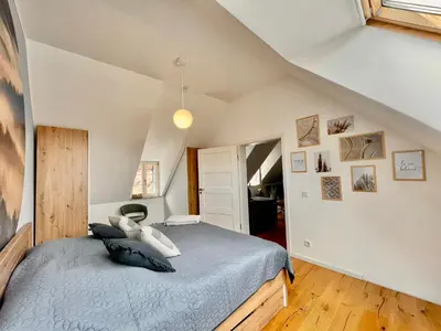 Ein Bett oder Betten in einem Zimmer der Unterkunft HOMELIKESTAY: Ferienwohnungen - Wernigerode - WLAN - Bestlage - liebevolle Einrichtung