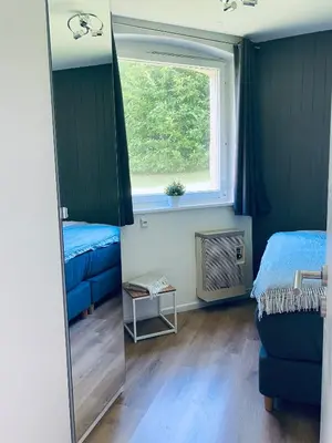 Ein Bett oder Betten in einem Zimmer der Unterkunft Duke-Fewo in der Villa Radau an der Bummelallee