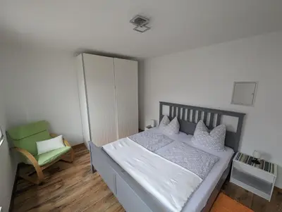 Ein Bett oder Betten in einem Zimmer der Unterkunft FEWO An der Bode