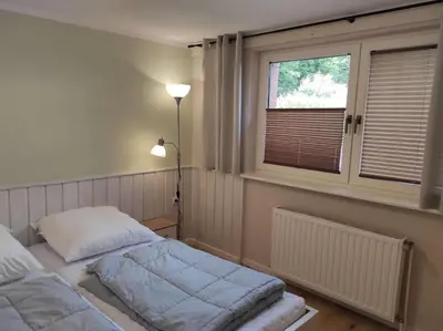 Ein Bett oder Betten in einem Zimmer der Unterkunft Gästehaus Harzklause 1