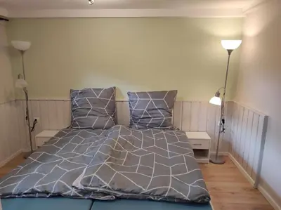 Ein Bett oder Betten in einem Zimmer der Unterkunft Gästehaus Harzklause 3