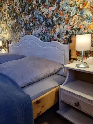 Ein Bett oder Betten in einem Zimmer der Unterkunft Ferienhaus zum Holzmichel