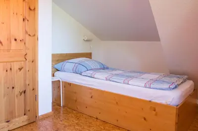 Ein Bett oder Betten in einem Zimmer der Unterkunft Ferienwohnung Ferienhäuser am Brocken, 80 qm, 3 Schlafzimmer