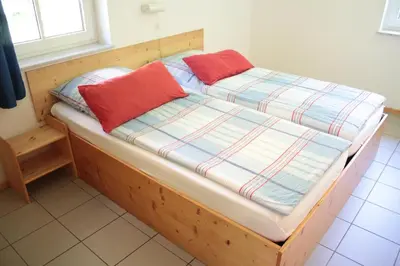Ein Bett oder Betten in einem Zimmer der Unterkunft Ferienwohnung Ferienhäuser am Brocken, 60 qm 2 Schlafzimmer