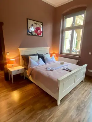 Ein Bett oder Betten in einem Zimmer der Unterkunft Villa Le Palais Quedlinburg