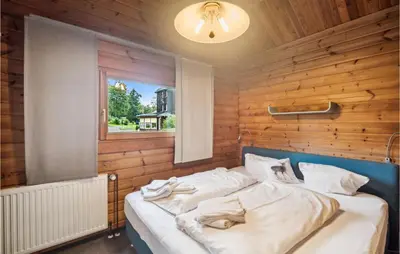 Ein Bett oder Betten in einem Zimmer der Unterkunft Amazing Home In Oberharz With Kitchen