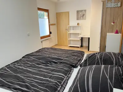 Ein Bett oder Betten in einem Zimmer der Unterkunft Ferienhaus Waldoase