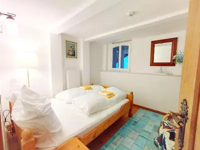Ein Bett oder Betten in einem Zimmer der Unterkunft Deluxe Appartement (70m2) bis 6 Personen im Oberharz Antik Villa im Harz