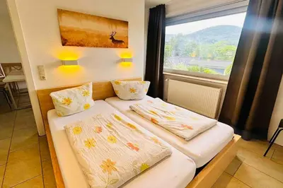 Ein Bett oder Betten in einem Zimmer der Unterkunft Goethestraße Ferienhaus