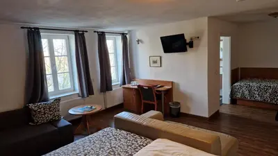 Ein Bett oder Betten in einem Zimmer der Unterkunft Hotel Garni Demmel & Cie