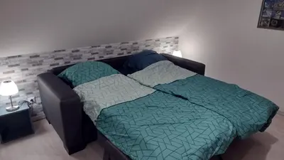Ein Bett oder Betten in einem Zimmer der Unterkunft FeWo Harzblickterrasse Goslar