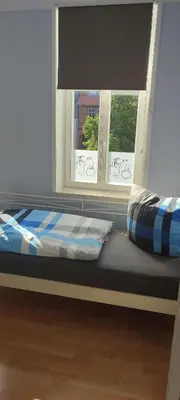 Ein Bett oder Betten in einem Zimmer der Unterkunft FeWo Am Tummelplatz