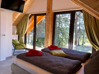 Ein Bett oder Betten in einem Zimmer der Unterkunft Naturstammhaus und Appartements Zum Brockenbaecker