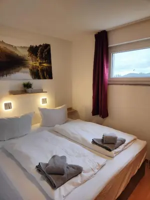 Ein Bett oder Betten in einem Zimmer der Unterkunft Apartment Bergzauber - traumhafter Ausblick & Pool