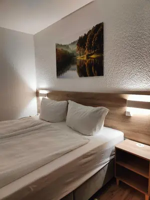 Ein Bett oder Betten in einem Zimmer der Unterkunft Apartment Hexenstube - traumhafter Ausblick & Pool