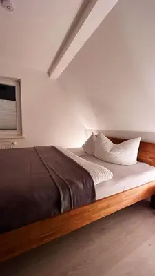 Ein Bett oder Betten in einem Zimmer der Unterkunft Ferienwohnungen Hexenstieg & Wurmbergblick