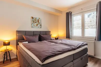 Ein Bett oder Betten in einem Zimmer der Unterkunft Fünf Harzer Berge Sonnenberg
