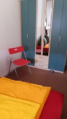 Ein Bett oder Betten in einem Zimmer der Unterkunft ALACARD Ferienwohnungen Höffgen Thale Harz