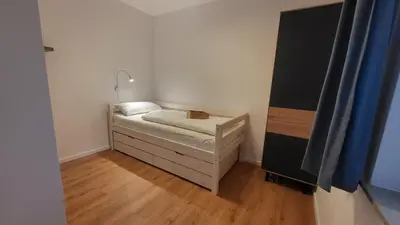 Ein Bett oder Betten in einem Zimmer der Unterkunft Ferienwohnung Berglodge 11 Hahnenklee Bockswiese