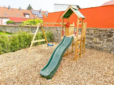 Ein Kinderspielbereich in der Unterkunft Alte Försterei 2.0