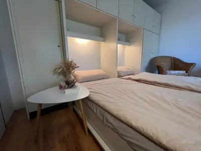 Ein Bett oder Betten in einem Zimmer der Unterkunft Moderne und zentral gelegene Ferienwohnung in Braunlage mit Rodelpiste und Start Ski Langlauf in 300 Metern Entfernung