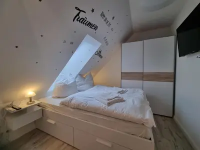 Ein Bett oder Betten in einem Zimmer der Unterkunft Haus Peter Wohnung 4