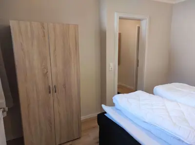 Ein Bett oder Betten in einem Zimmer der Unterkunft Gästehaus Harzklause 4