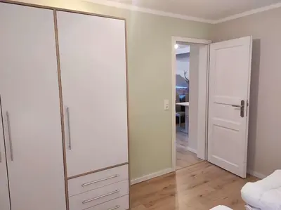 Ein Bett oder Betten in einem Zimmer der Unterkunft Gästehaus Harzklause 6