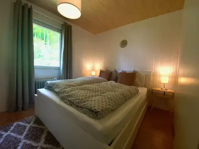 Ein Bett oder Betten in einem Zimmer der Unterkunft Ferienhaus am Reiterhof
