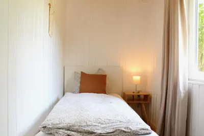 Ein Bett oder Betten in einem Zimmer der Unterkunft Ferienhaus am Reiterhof