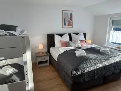 Ein Bett oder Betten in einem Zimmer der Unterkunft TraumFeWo Morgentau #Netflix #Terrasse von Harztraveler