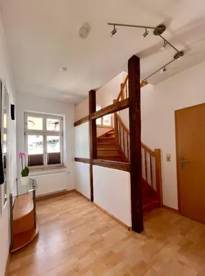 Ein Bett oder Betten in einem Zimmer der Unterkunft Ferienwohnungen Am Kaufmannshof