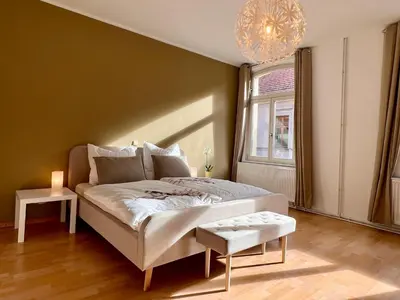 Ein Bett oder Betten in einem Zimmer der Unterkunft Ferienwohnungen Am Kaufmannshof