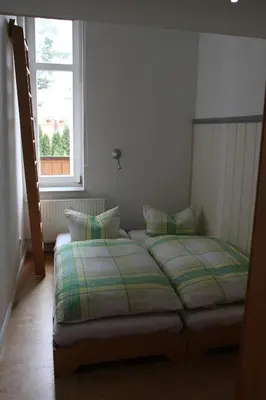Ein Bett oder Betten in einem Zimmer der Unterkunft JS Feriendomizile: FeWo Charlotte