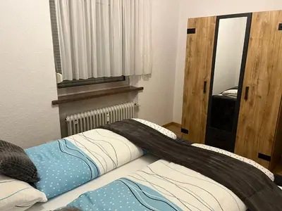 Ein Bett oder Betten in einem Zimmer der Unterkunft Ferienhaus International 2