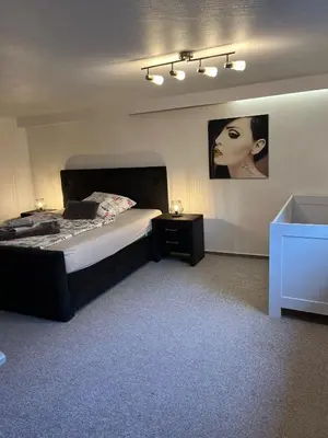 Ein Bett oder Betten in einem Zimmer der Unterkunft Ferienhaus International 2