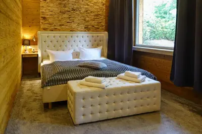 Ein Bett oder Betten in einem Zimmer der Unterkunft Wolfstein - Le Boutique Hotel
