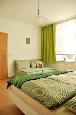 Ein Bett oder Betten in einem Zimmer der Unterkunft Ferienwohnung Wanderfreund