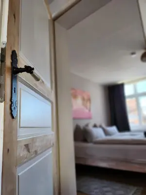 Ein Bett oder Betten in einem Zimmer der Unterkunft Ferienwohnung im Konvent