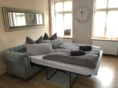 Ein Sitzbereich in der Unterkunft Ferienwohnung im Konvent