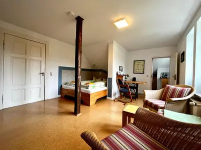 Ein Bett oder Betten in einem Zimmer der Unterkunft JS Feriendomizile: FeWo Nest