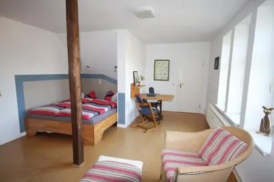 Ein Bett oder Betten in einem Zimmer der Unterkunft JS Feriendomizile: FeWo Nest