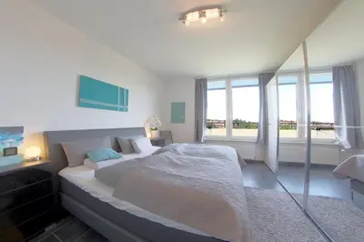 Ein Bett oder Betten in einem Zimmer der Unterkunft Penthouse 383
