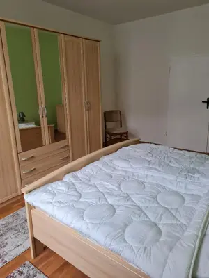Ein Bett oder Betten in einem Zimmer der Unterkunft Ferienwohnung am Tiergarten