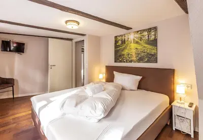 Ein Bett oder Betten in einem Zimmer der Unterkunft Ferienwohnungen am Kornmarkt I