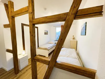 Ein Bett oder Betten in einem Zimmer der Unterkunft Harzhaus Drei Hexen